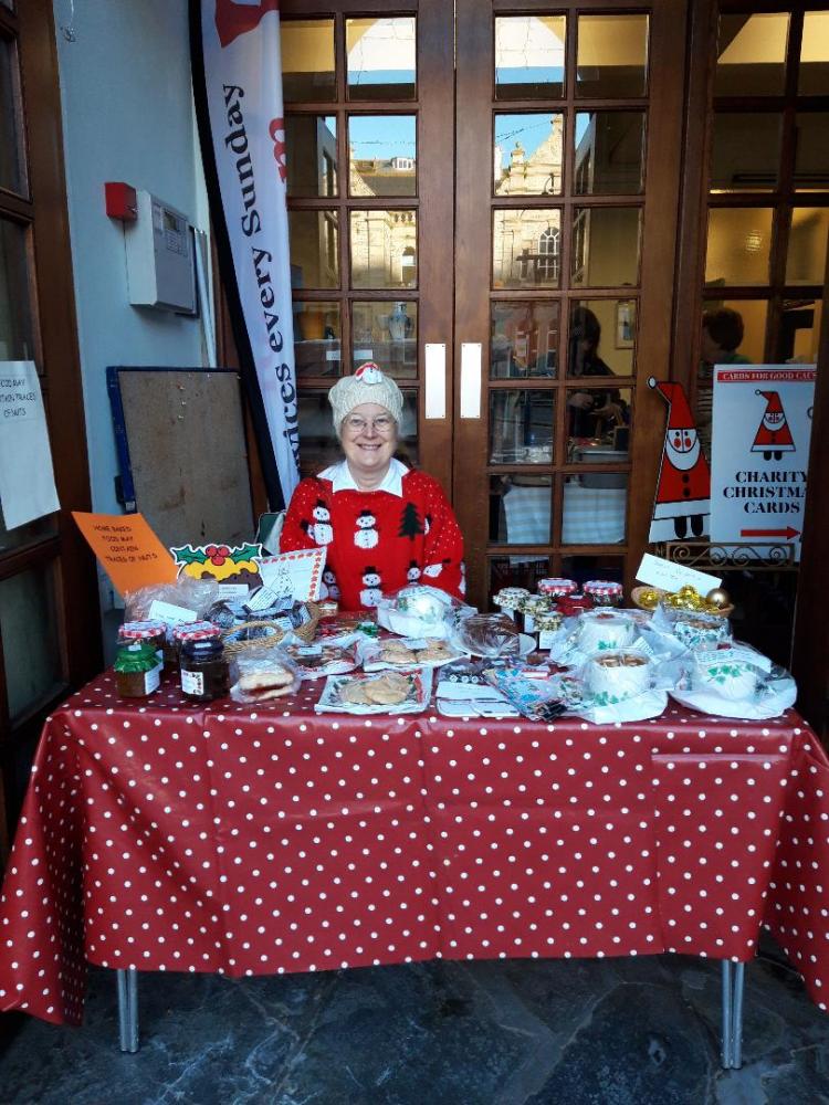 Selling delicious cakes and other goodies made by members of the church