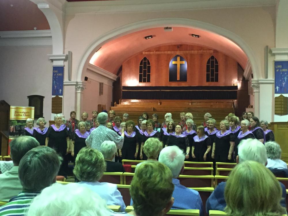The combined choirs sing together for the final item